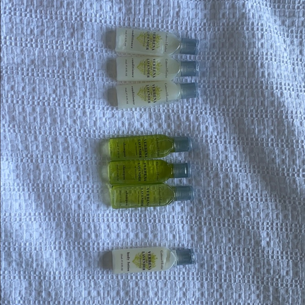 Travel set for lotion, shampoo, and conditioner.